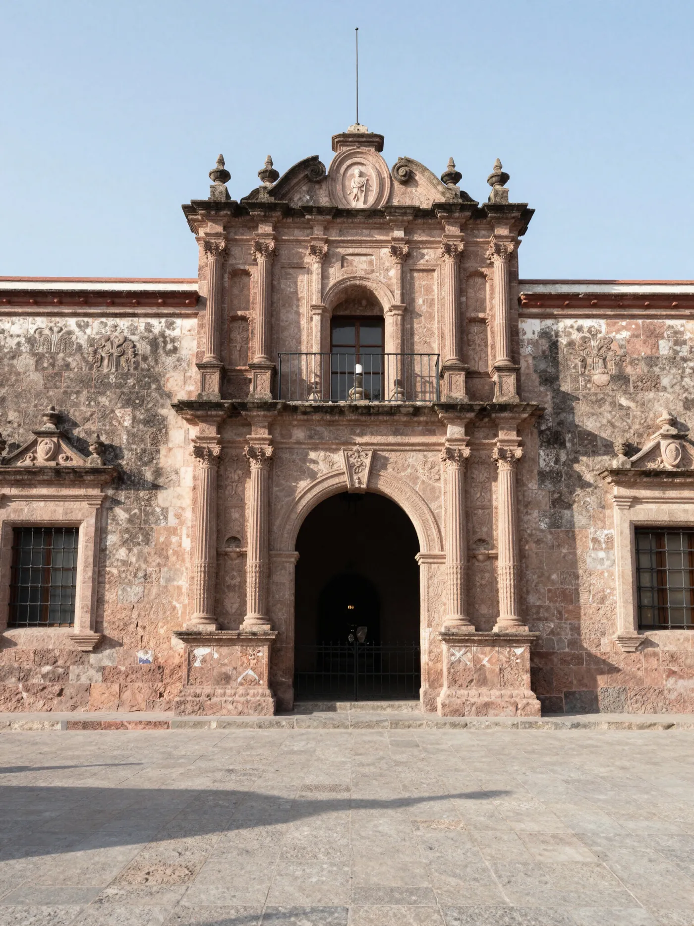 A carved pink cantera stone baroque facade in San Miguel de Allende